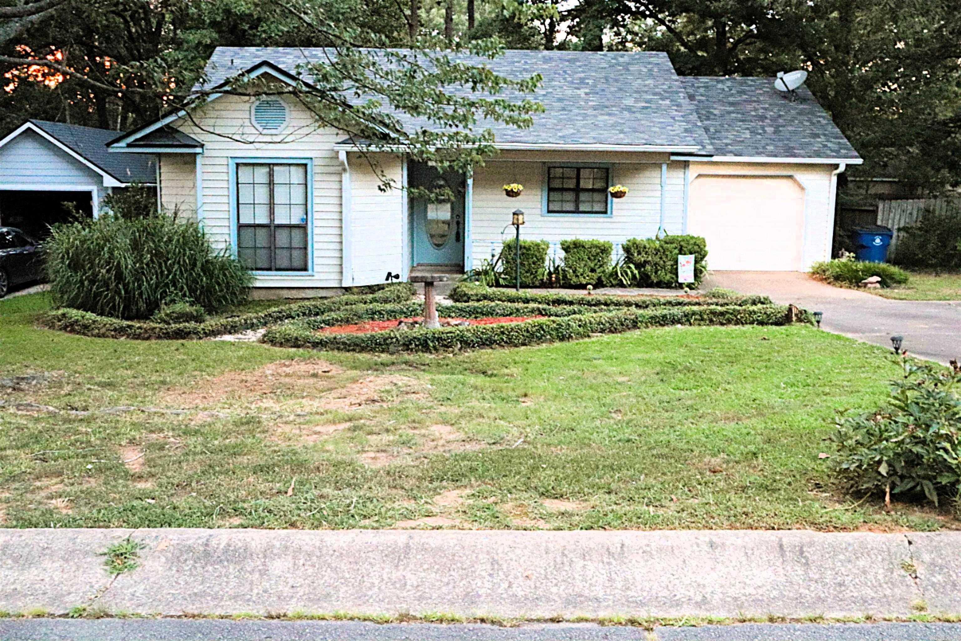 Check out this charming two-bedroom, two-bathroom home in the desirable Rolling Oaks Subdivision! Featuring a spacious, open floor plan, this home offers a large living area with a cozy gas fireplace, perfect for relaxing or entertaining. Additional highlights include a one-car garage, a welcoming front porch, a deck ideal for outdoor gatherings, and an outdoor storage shed for added convenience. Enjoy the benefits of a tankless water heater, a newer roof (less than 5 years old), upgraded kitchen countertops, and an updated bath and shower. The refrigerator, washer, and dryer are all staying with the home.