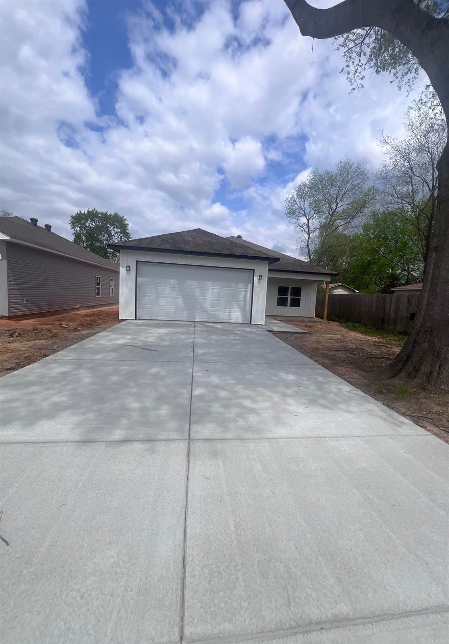 House is just 2 weeks from completion!  New 3 bedroom 2 bath construction conveniently located to Bryant High School.  Home has beautiful hybrid flooring throughout that gives the appearance of hand scraped hardwood. Kitchen and bathrooms are completed with 3cm granite and custom built cabinets. Master shower is tiled for a classic appearance and has single vanity. Nice walk-in closet in what you find behind the barndoor. Home boasts 9ft ceilings and LED lighting. Back patio perfect size for your grill and chairs for relaxing.  Don't miss this Bryant New construction opportunity.