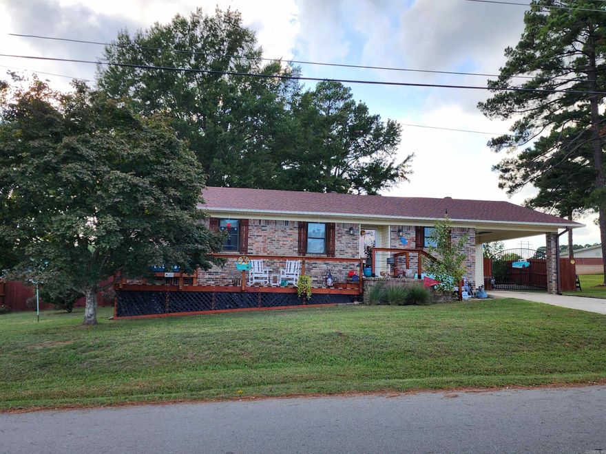 Beautiful showman's home on corner lot across from the Sheridan Football field! This home has been totally renovated in 2018 all like new with all the things and its Next to the schools! The home features exotic hardwoods, one of a kind handmade vanities, mirrors shelving, and more. Backup generator, beautiful porches front back, and security galore. Behind the home it has a large shop heated shop, heated and cooled she shed, and a large RV/Camper covering fully fenced in this secure backyard.  Come see this one before its gone!