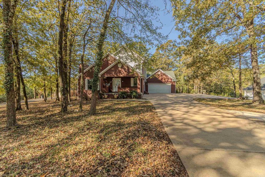 Spacious Brick Home on 1.20 Acres in Southwest Jonesboro  This beautiful 3,686 sq. ft. home offers 3 bedrooms and 3.5 baths, blending comfort and style throughout. The main level features a welcoming living room with hardwood flooring and a cozy fireplace, a dining area, and a kitchen with granite countertops, subway tile backsplash, and stainless steel appliances. A convenient laundry room with sink and a spacious primary suite with a private office complete the main floor.  The updated primary bath includes a stunning 7x3.5 ft tile walk-in shower and double vanity. Upstairs, you’ll find two additional bedrooms and a full bath. The walk-out basement provides even more living space with new carpet, an additional room, a fireplace, and abundant storage.  Situated on a large, wooded 1.20-acre lot on the southwest side of Jonesboro, this property offers both privacy and convenience—perfect for those seeking space and comfort in a serene setting.