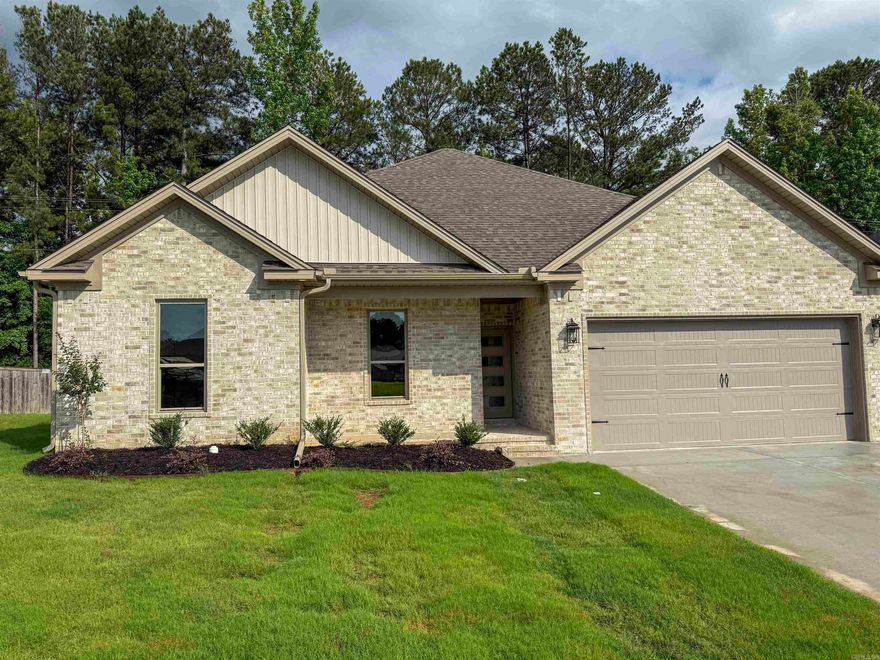 This stunning new construction in Foxwood Gardens sits on a quiet cul-de-sac and offers 3 bedrooms, 2.5 bathrooms, a bonus room, and 2,140 sq ft of beautifully finished living space. The open-concept layout features a spacious living area with a sleek LED fireplace framed by a shiplap chase. The kitchen boasts quartz countertops, a large island with seating, stainless steel appliances, and a subway tile backsplash. The primary suite is conveniently located on the main floor and includes a tray ceiling, walk-in closet, and a spa-like bath with dual vanity and a walk-in tiled shower. Upstairs, a versatile bonus room offers space for work, play, or relaxation. Two additional bedrooms share a stylish full bath. Luxury vinyl plank flooring, stair lights, recessed lighting, and modern finishes add warmth and style throughout. The laundry room includes built-in floating shelves for extra storage. Enjoy outdoor living on the covered porch with a patio deck and the convenience of a 2-car garage.  Call or text today to coordinate your personal tour!