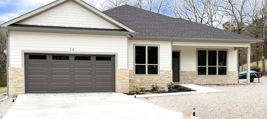 Escape to your own private oasis on the Coronado Golf Course in Hot Springs Village! This stunning better than new-construction home delivers luxury, tranquility, and an unbeatable lifestyle.  The open-concept design features soaring ceilings and seamless flow from a spacious living area with tasteful built-ins to a gourmet kitchen centered around a massive waterfall quartz island—perfect for entertaining and everyday living. Floor-to-ceiling windows bathe the home in natural light while framing breathtaking panoramic views of the #12 fairway's park-like grounds.  The primary suite is a true retreat, boasting a spa-like bathroom with dual vanities and an oversized walk-in shower. Step out to the enormous covered back patio to soak in the serene, manicured landscape right from your doorstep.  Highly energy-efficient and low-maintenance throughout, this home lets you enjoy the good life with easy access to the Coronado Fitness Center, tennis and pickleball courts, and the scenic 18-hole executive golf course.  You're not just buying a home—you're investing in an exceptional lifestyle.