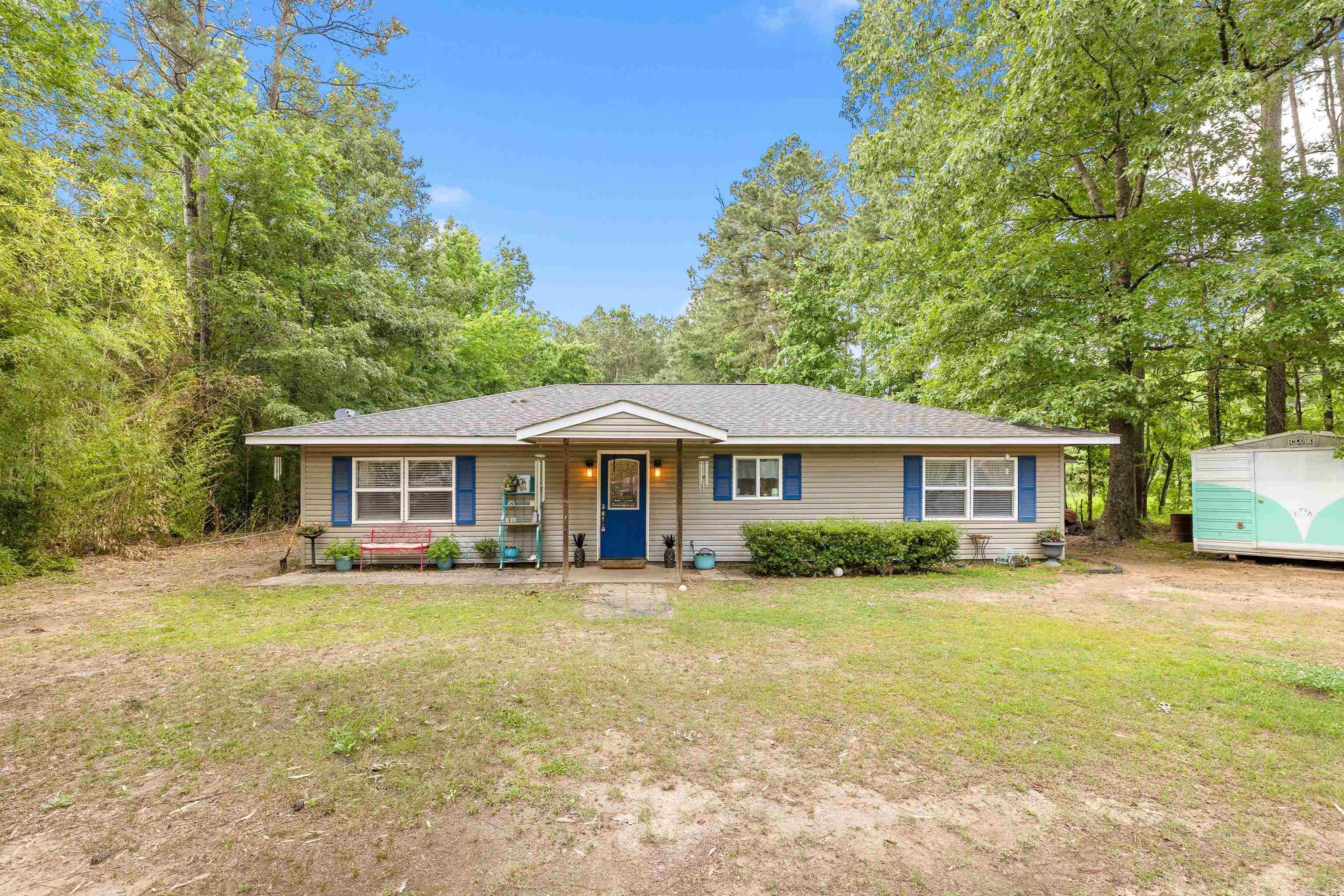Come see this open floorplan home in the country on 3.47 acres. With 3 bedrooms and 2 bathrooms, this property has laminate hardwood and tile throughout the house. The master bath has plenty of space and offers a jetted tub and a double vanity. The kitchen has stainless appliances with plenty of countertop space, under-counter storage, and cabinets. In the back yard ther is plenty of space and includes a fully fenced in area, and the out-buildings are great for multiple uses.