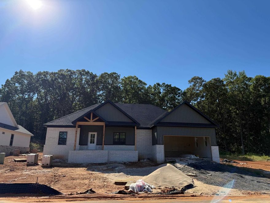 Closing cost, up to $10,000 paid by seller!! 2-10 Home Warranty paid by seller as well. New construction - will be complete by Christmas! Discover the perfect blend of elegance and comfort in the stunning all-brick, Craftsman style home. With 4 spacious bedrooms and 2 luxurious bathrooms, this exquisite property offers an inviting retreat for both relaxation and entertainment. As you step through the front door, you'll be greeted by an expansive living area bathed in natural light, thanks to the large windows that highlight the beauty of your surroundings. Culinary enthusiasts will adore the kitchen and large pantry for extra organization and storage. The custom tile shower in the primary bathroom adds a spa-like experience to your daily routine. Outdoor living is equally impressive with a large, covered patio providing the perfect backdrop for weekend entertainment. Additional features include a two-car garage offering ample parking space and storage. This home is a haven of sophistication and warmth, ready for a family to create lasting memories.