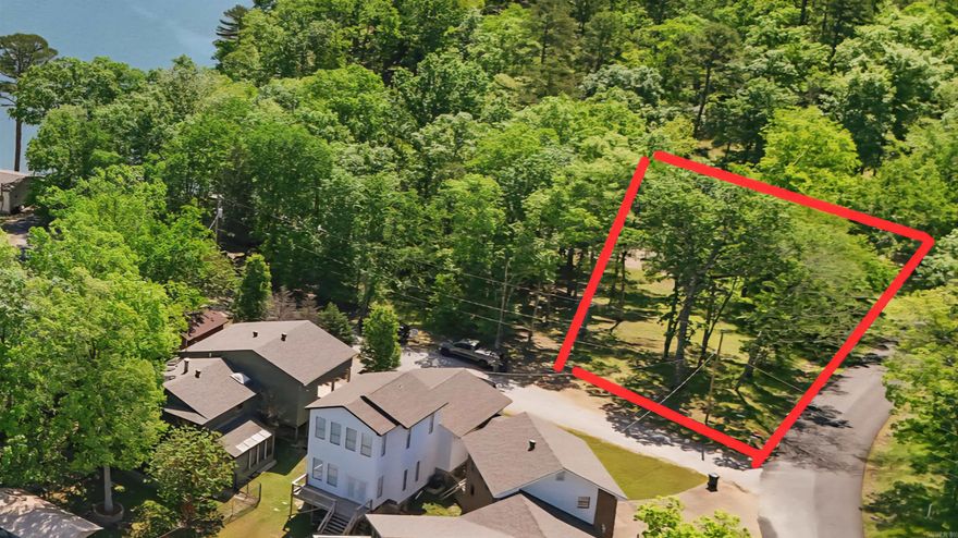 Discover the perfect blend of convenience and natural beauty with Lot 11R on Charlie Stover. Featuring pristine lake frontage on sought-after Lake Hamilton, this property is more than just land—it’s an opportunity to create a lakefront lifestyle. With septic already installed along with public water and electricity at the property, this property allows you to focus on designing the retreat you’ve been dreaming of.  Imagine morning coffee with sparkling water views, afternoons on the boat, and evenings watching the sun set across the lake—all from your own private shoreline. Rarely does a property combine ready-to-build utilities with such an ideal setting on Lake Hamilton. Whether you envision a full-time residence, a weekend getaway, or a long-term investment, this lot is a rare chance to bring your vision to life.