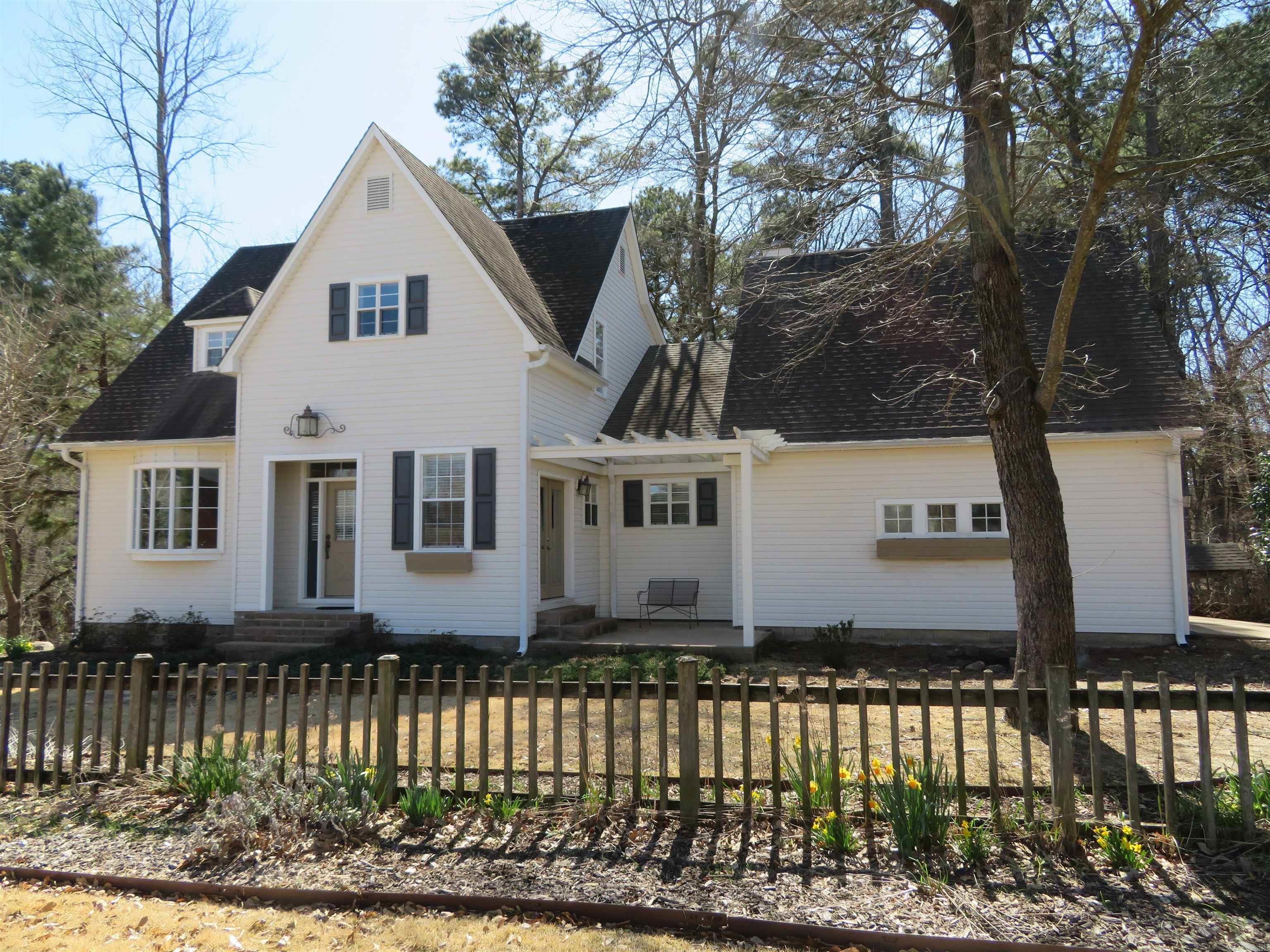 2-LEVEL, CRAFTSMAN-STYLE BEAUTY --- Custom-built in 1996 and UPDATED in an AWESOME way by the second Owner (2008 to present day) over the course of her 16+ years of ownership)! Approx. 2,062 SQ. FT., centrally heated/cooled. Main-level features ALL 9' CEILINGS, an ENTRY/stair-hall, a separate DINING ROOM with large BOW WINDOW, an EAT-IN KITCHEN with French doors to a front/side patio with pretty Pergola (architectural trim), a LIVING AREA with FIREPLACE and a triple French door unit to exterior deck with VIEW OF WOODS/nature, AND the Principal BEDROOM with a 'wall of closets' and a private, LUXURIOUS BATHROOM with large 'walk-in' shower! Plus, the main-level boasts a guest half-bath, a separate laundry room, and a 'step-down' DOUBLE GARAGE. Upper-level features a stair-hall, THREE BEDROOMS, and a HALL BATHROOM (full). There is also a BONUS 'WALK-OUT' BASEMENT SHOP area (13'2" x 24'4") --- accessible from the exterior only, inside a tall, decorative, wrought-iron looking fence (6' tall) with 3 separate gates, encompassing A PORTION of the large, sloping, tree-shaded, back yard. This Property INCLUDES AN EXTRA, ONE-HALF LOT located East of the residence (with street frontage)!