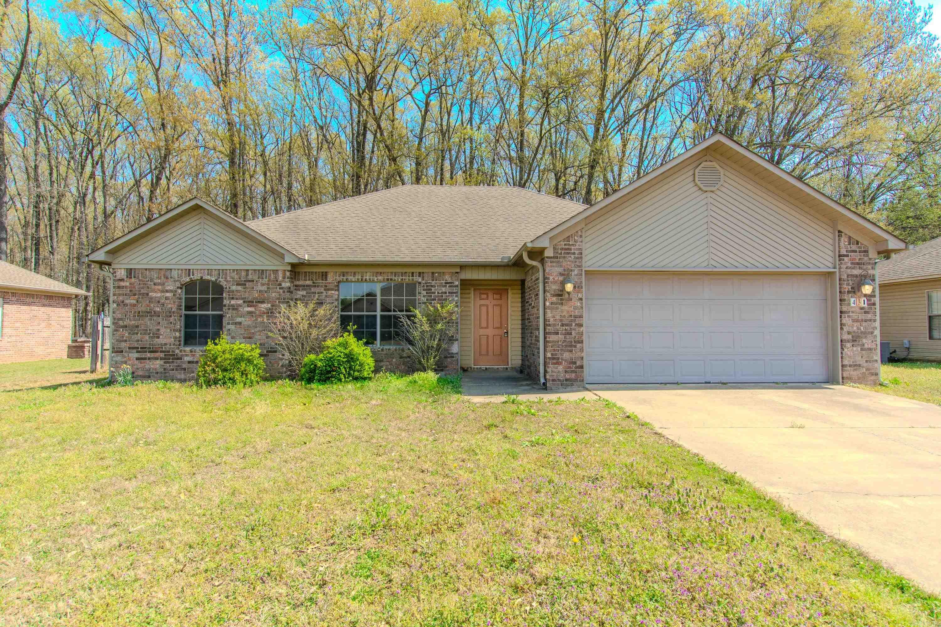 Super nice home ready for your family to move in! Spacious living area with double tray ceiling and corner fireplace. Kitchen features plenty of counter space, breakfast bar, pantry. Spacious bedrooms with great master bath! You'll love the private fenced backyard that backs up to woods. All new flooring and paint too! Community fishing pond and park within walking distance. Home is virtually staged. Call to see this one today