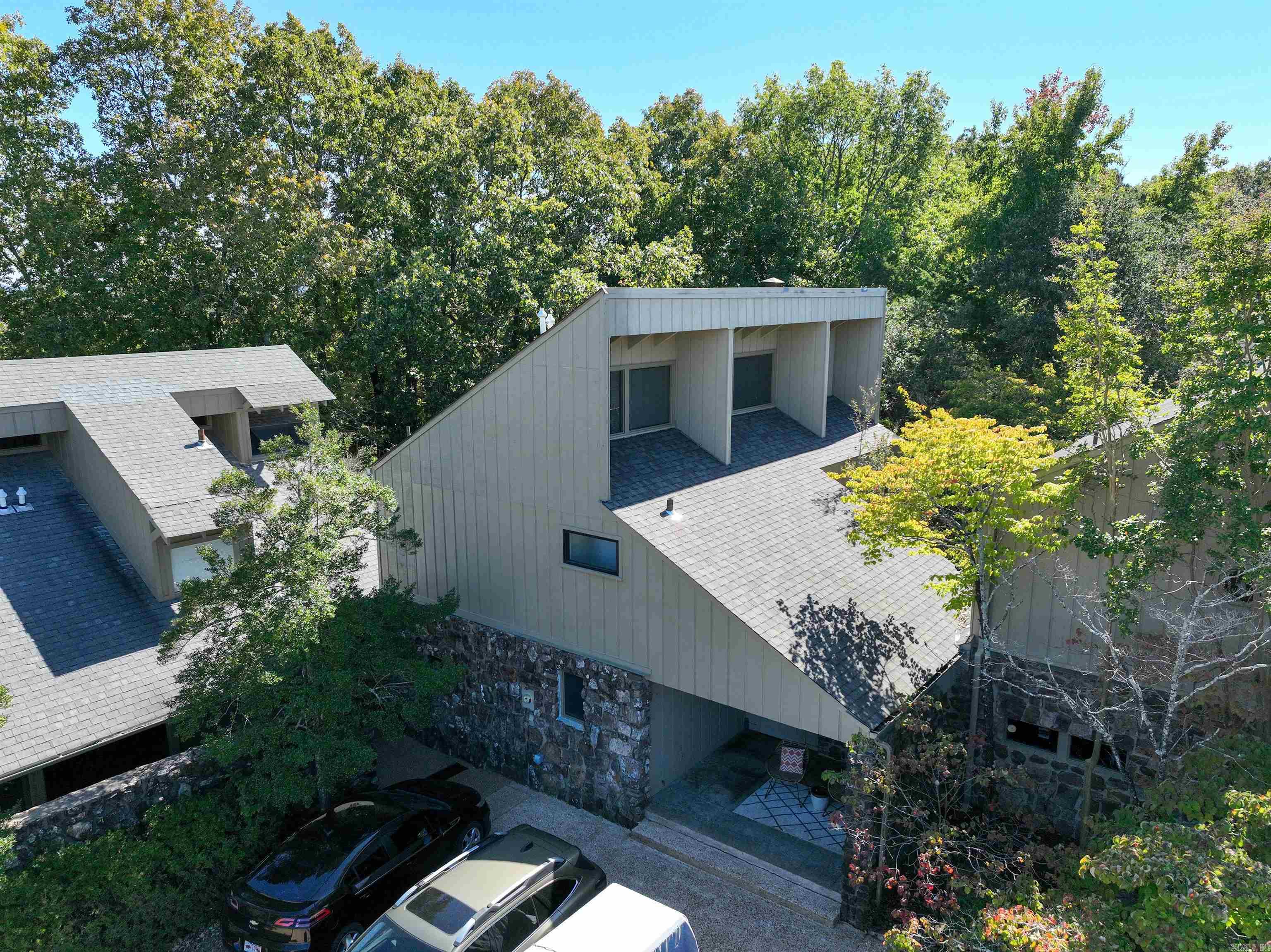 This FURNISHED Eden Isle townhome is right across the street from the Red Apple Inn! Open floor-plan with tall ceilings, wooden walls and ceilings, scored concrete floors, lots of glass, wood-burning fireplace, great covered front porch and private backyard! Would make a great get-a-way or vacation rental! 5 minute golf cart ride to Eden Isle Marina!