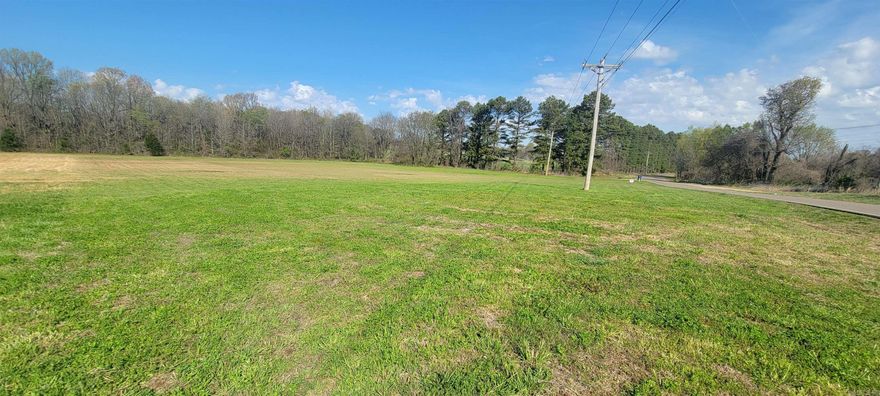 After driving by and seeing this tract of land, now go get all of those different house plans you fell in love with, bring them back out and decide which one will look the best on it. Dad you can even plan of the perfect spot for his shop. Another thing to think about is the built in privacy. You've already gotten privacy on right by the trees that line the neighbor's driveway. Walk to the back of the three acres step into the woods and you'll see survey markers about taking about fifty steps into the woods. That should be of privacy  in the back. To the left of the house, you'd only have visitors three times a week. Why, because a church has purchase that seven acres. Just think of the extra parking/play ground area they might let you take advantage of when they aren't having services. Call the agent you trust the most and let them know you want more details about this land. If you aren't working with an agent. Drive by and call the agent's number on the sign. SEE Agent Remarks