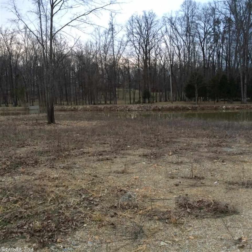 Beautiful 2-acre lot for sale in Stonehill Estates in The Hills in  the Bryant School District. 1 acre is flat, cleared land ready to build your  dream home. Looking out at your backyard is a peaceful 1 acre pond. Lots of  space between neighbors with all paved roads. Minimum square footage to build  is 1800 square feet.