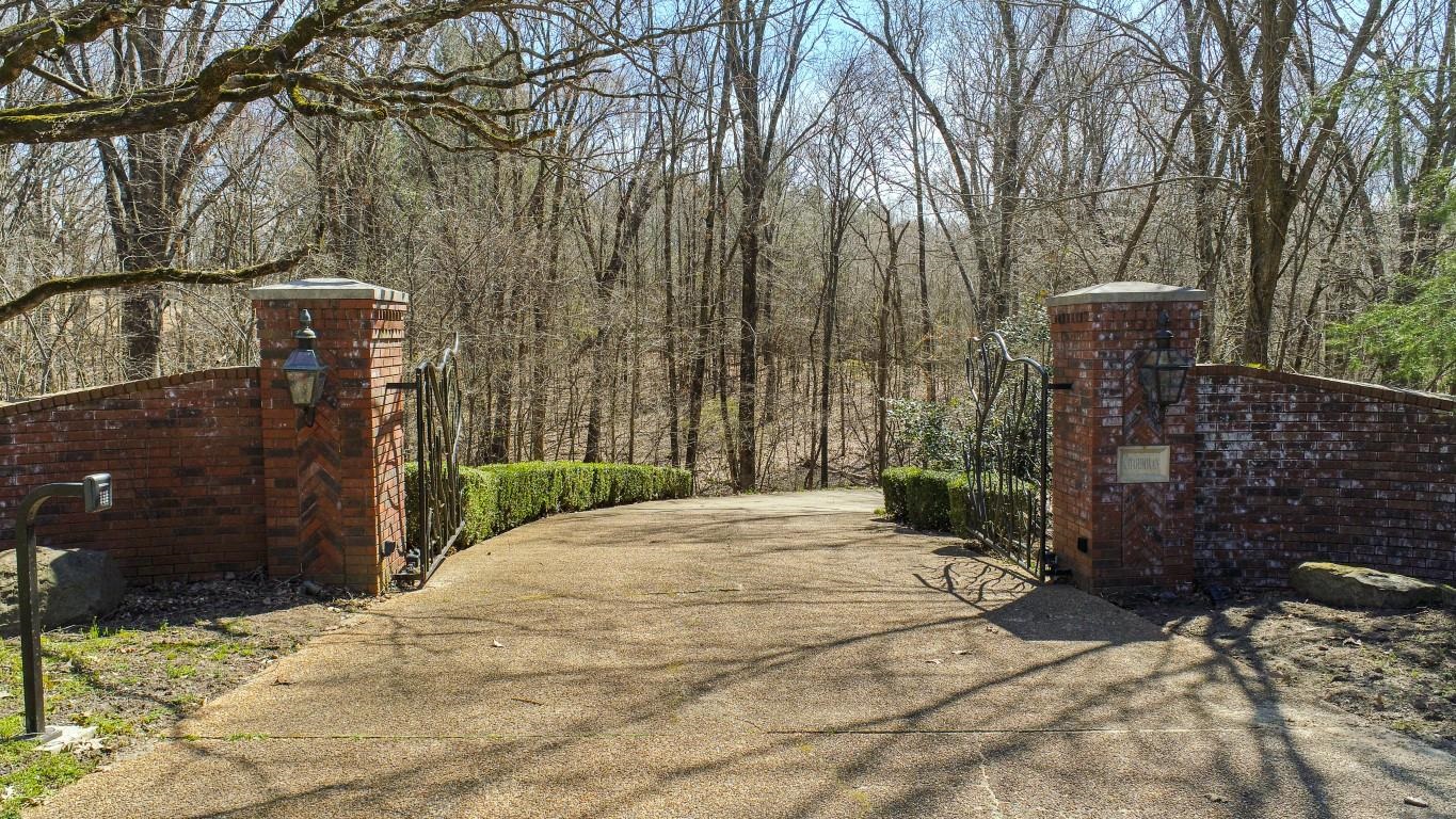 Nestled within private wooded land in Jonesboroās Premier Golf Course Community, this breathtaking gated estate offers unparalleled privacy & luxury on approximately 14 acres +/- of pristine land. A true retreat, the property features a spacious main residence overlooking a serene 1-acre private lake along with a guest house. Step inside to discover 6 spacious bedrooms & 6 full baths, complemented by an abundance of natural light pouring in through large windows. The gourmet chefās kitchen is a culinary dream, boasting a Sub-Zero refrigerator & freezer, Bosch dishwasher, Dynasty 6-burner range w/griddle & 2 ovens, granite countertops, coffee bar, & an insulated wine cellar w/Breezaire cooling system, & a large walk-in pantry. The luxurious master suite is a private oasis, featuring an oversized shower, soaker tub, expansive walk-in closet, & an exercise room w/stunning lake views. Additional highlights include: An inviting hearth room w/charming Old Chicago brick flooring, 3 fireplaces, 2 staircases, safe room, theater room, game/exercise room, office, laundry w/tiled dog-washing area, oversized 4-car garage, earthquake-resistant construction, & prepped for gas generator.