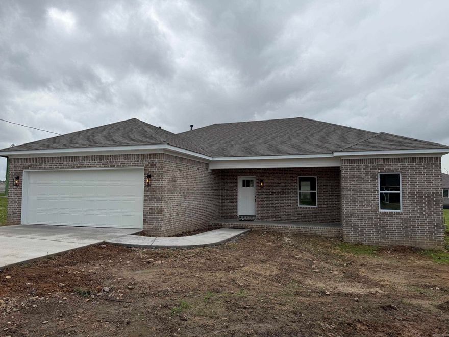 Affordable new custom home in a quiet neighborhood! This 3-bedroom, 2-bathroom home features an open living/dining floor plan with luxury vinyl plank floors and 9' ceilings. The kitchen includes a quartz breakfast bar, a deep sink, and modern appliances. The master bedroom is spacious, and the master bath offers a separate walk-in shower with a seat and a walk-in closet. A large laundry room adjoins the oversized two-car garage. A one-year builder's warranty is included.