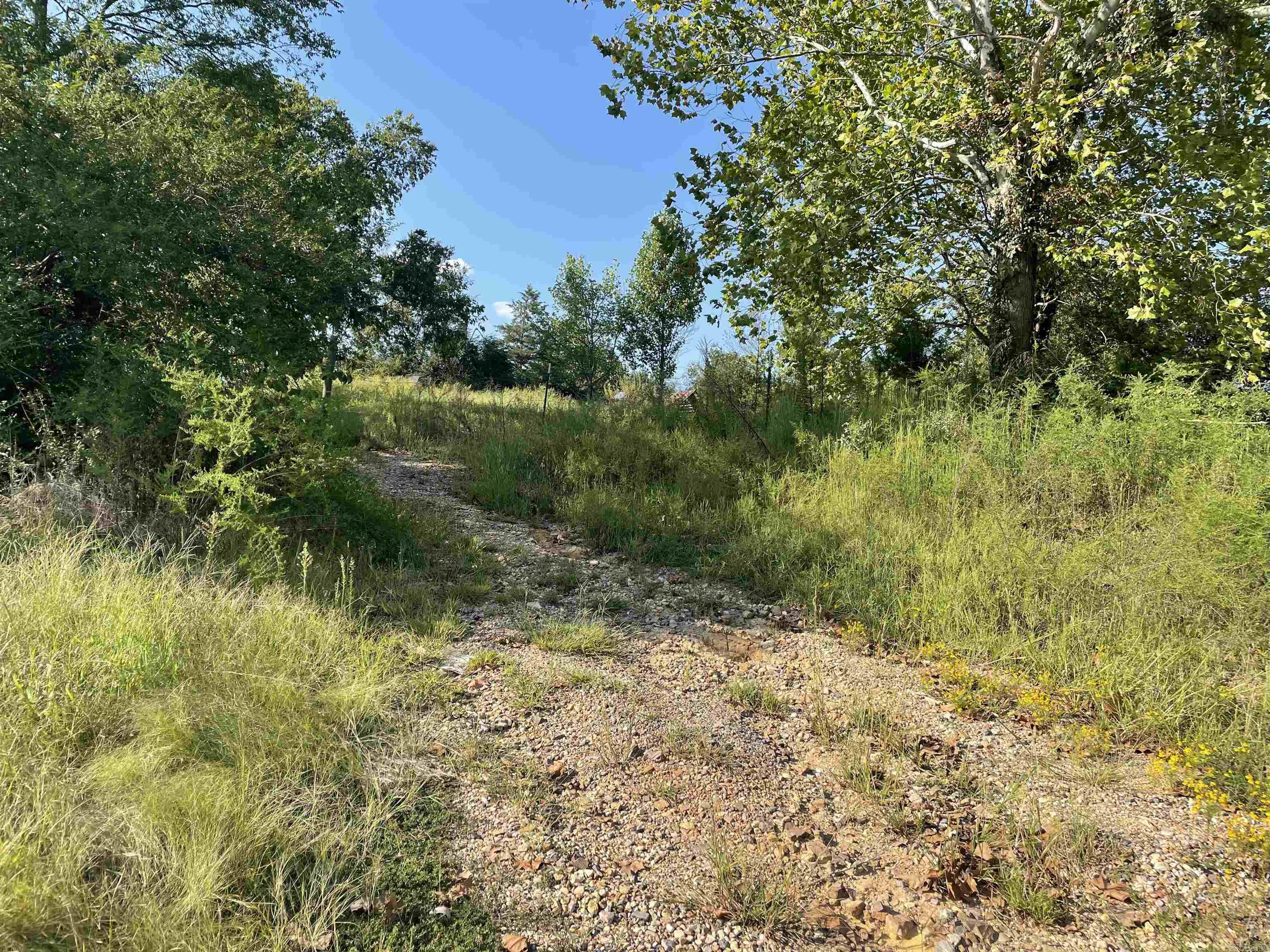 1 acre on Hwy 70, includes electric, water, and septic. Ready for your home! More acreage and a home available. See MLS # 23026227