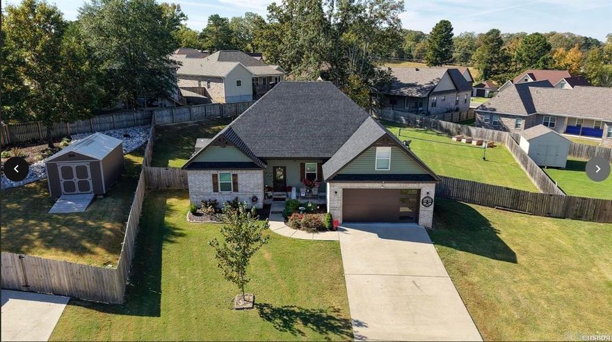 Looking for the cutest home in Lake Hamilton School District and close to everything? This attractive white brick home has 4 or 5 bedrooms (bonus room above the garage for 5th b/r, man cave or hideout) and 2 baths. Nice curb appeal with front yard landscaped and sprinkler system. Home offers open floor plan with kitchen, dining and living area with gas f/p framed with an attractive mantel. The door to back yard opens to a covered patio with seating and separate grilling area. Are you ready for a great back yard? Check out pic with playground equipment already in place to enjoy and a small shed to store toys. Owners have done upgrades to include extra insulation, all interior has new paint and flooring '24, new roof and siding '23, tankless hot water '25, new AC unit '25 and new blinds throughout! A really cute house! Don't let this one get by you, hurry and come see! Security system is hard wired in homebuyer can check with provider for service. Refrigerator, washer/dryer do not convey.