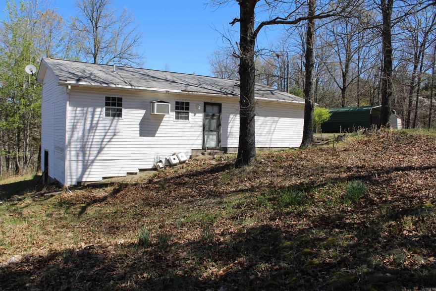 MINUTES FROM LAKE NORFORK ACCESS! This amazing property is sitting at the end of a dead-end road and touches the government strip! Located minutes from town and unrestricted! You will love all of the beautiful fruit trees and gorgeous dog wood trees.  Featuring two bedrooms, two full baths, sunroom, 8x8 green house, and a detached carport. Large Walk-in cinderblock crawl space with Water heater and well pressure tank, plus extra storage space.  Home is waiting for you to come show it some love and bring it back to life! Property is sold as is.