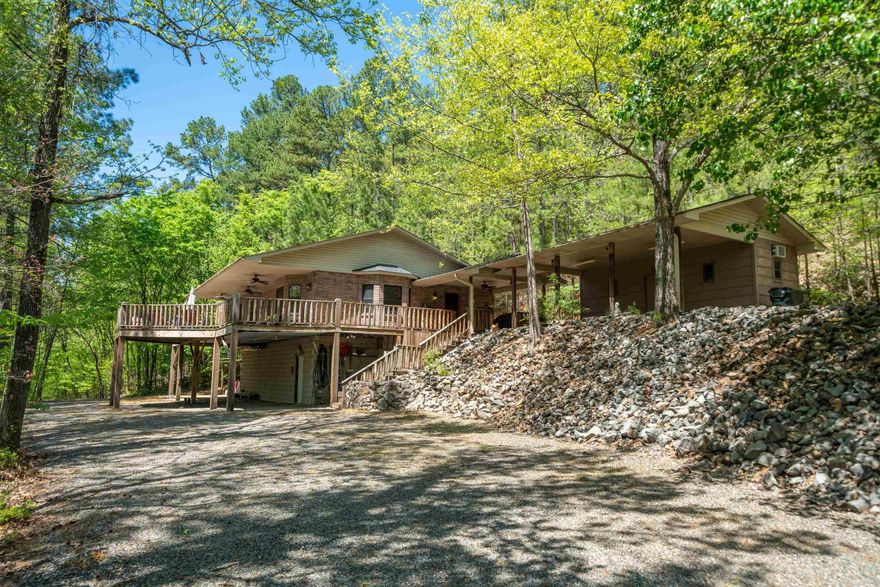Charming Lake View Retreat on 3.95 Acres! Perched on a peaceful hilltop with lake views, this unique 2 bedroom, 2 bathroom home offers the perfect blend of tranquility and comfort. Sitting on nearly 4 acres, the property features a spacious porch ideal for relaxing or entertaining while taking in the serene surroundings. Currently a successful short term rental, this fully furnished home is move-in ready and would make an excellent primary residence, vacation getaway or income producing property. Additional perks include two outdoor storage buildings, providing ample space for tools, toys, or hobbies. A rare opportunity to own a furnished lake-view retreat with room to roam. Schedule your showing today!