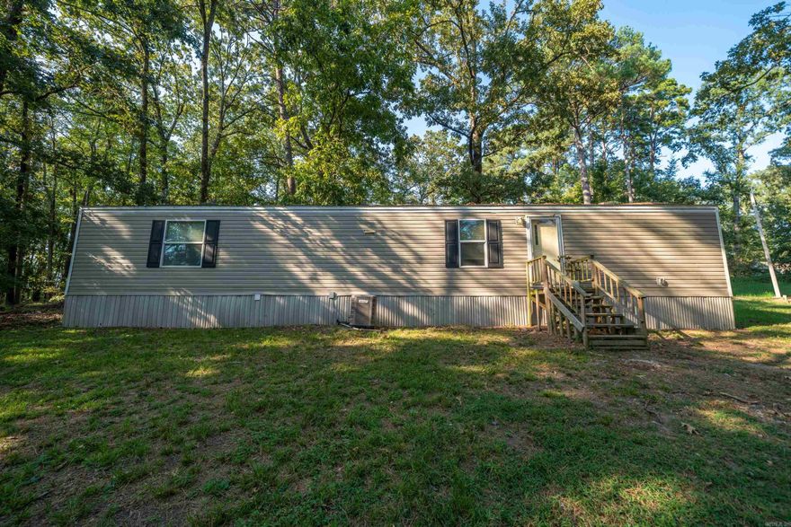 Affordable 2-Bed, 2-Bath Mobile Home Surrounded by Nature Looking for peace, privacy, and a budget-friendly place to call home? This 2-bedroom, 2-bath mobile home sits in a quiet area surrounded by woods, offering a relaxing setting without breaking the bank. The home itself could use a little TLC, but it has everything you need at an affordable price. With its low cost and private location, this property also makes a great investment opportunity—perfect for a long-term rental. Schedule a showing today and see the potential for yourself!