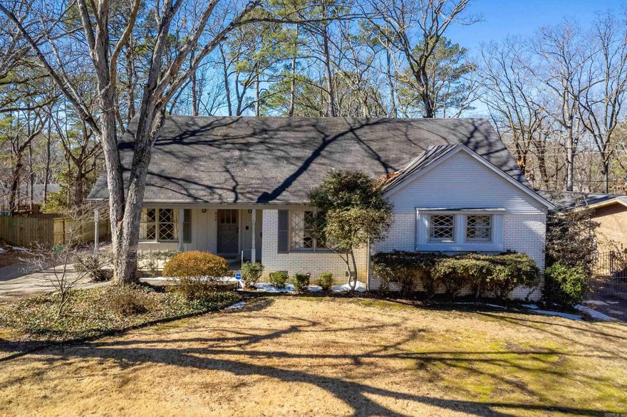 This charming family home offers original character thru-out and a classic layout with defined living spaces and flexible room options. A covered front porch opens to a central entry, with formal dining room to the left and formal living room to the right, both featuring large front windows that provide abundant natural light and a comfortable space for everyday living or entertaining. The eat in kitchen offers plenty of cabinets and connects to the rear of the home and a door leading to a deck overlooking the fully fenced, private backyard surrounded by mature trees. A cozy den anchors the back living space and includes a gas log fireplace, built-in shelving, and back yard access. The main level includes a primary bedroom with private en-suite bath, along with a guest bedroom with convenient access to a full hall bath. A main level laundry room includes stairs leading to a 337 sq ft finished basement (included in total square footage), ideal for a playroom, hobby space, or additional storage. Upstairs offers three bedrooms and large full bath, along with attic access and large closets, providing ample storage and flexibility for a variety of needs. Come see!