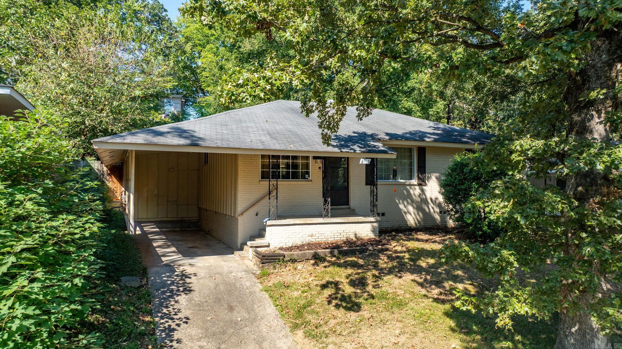 Step onto Cedar Street in Park Hill—one of North Little Rock’s most beloved neighborhoods, known for its tree-lined streets, local parks, and a community that still feels connected. Just a short walk to Idlewild Park and Lake Number One, you’re surrounded by everyday places that make life feel easy and rooted. Inside, the original hardwood floors ground the home in character, while a semi-open layout keeps the living room, dining, and kitchen connected. The kitchen has granite counters and stainless appliances—updates that blend function with style. Two guest bedrooms and a full bath sit off the hall, while the primary suite is set apart at the back for privacy, complete with its own bathroom. A new HVAC system (2024) and energy-efficient vinyl windows make the home as practical as it is comfortable. Here, you’re minutes from JFK Boulevard, local shops, dining, and interstate access—but you’ll come home to the calm of Park Hill, where convenience meets quiet.