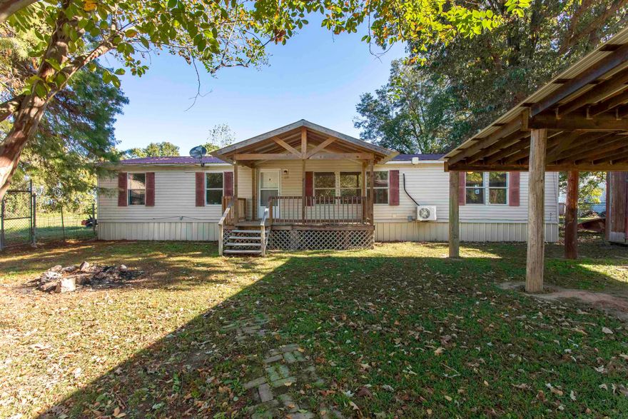 Move-in ready 3BR/2BA home in Reyno, AR—now offering a $1,500 appliance credit, perfect for first-time home buyers. This well-kept manufactured home sits on a shady, fenced lot with a covered front porch and a spacious two-car carport. Inside features fresh updates, new flooring, neutral colors, and two living areas, including one with a cozy stone fireplace. The kitchen offers freshly painted cabinets, updated hardware, ample counter space, and both electric and gas hookup options for added flexibility. The split floor plan provides a private primary suite with double sinks, a walk-in shower, and a soaking tub. Located less than 20 minutes to both Corning and Pocahontas, this home offers an easy commute and convenient access to shopping, dining, and services. Additional features include a metal roof, two energy-efficient mini-splits, and low-maintenance finishes throughout. Minutes from the Current River, this home is ideal for buyers seeking affordable living near outdoor recreation. With the added $1,500 appliance credit, you can choose the appliances that fit your needs and style from day one.