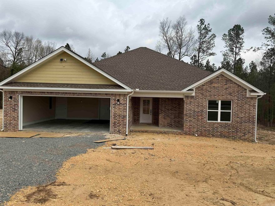 Welcome to this charming 3 bedroom, 2 bathroom home situated on 2.28 acres that offers privacy and a peaceful wooded backdrop. This home features an open, split floor plan designed for both comfort and functionality. The spacious suite is a true retreat, complete with a soaking tub, walk-in shower, dual vanities, and separate his and her closets. The kitchen offers a convenient pantry, gas stove and flows seamlessly into the living room- perfect for entertaining. Don't miss your chance with this home!! Schedule your showing today!!