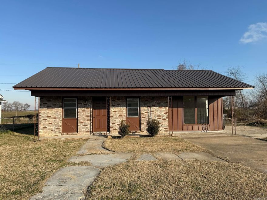 Just Listed in Trumann, AR!  This beautifully remodeled home is move-in ready and features stunning upgrades throughout. Inside, you'll find brand-new cabinets, sleek countertops, stainless steel appliances, and modern ceramic tile and LVP flooring. Enjoy fresh, updated spaces with new sinks, faucets, fans, fixtures, and a stylish new vanity. The home boasts a fresh coat of interior paint and updated exterior wood siding. Outside, the spacious backyard includes two large outbuildings (12x24 and 12x10)  perfect for storage, hobbies, or a workshop. Don't miss out on this fantastic home that blends modern style with functionality!