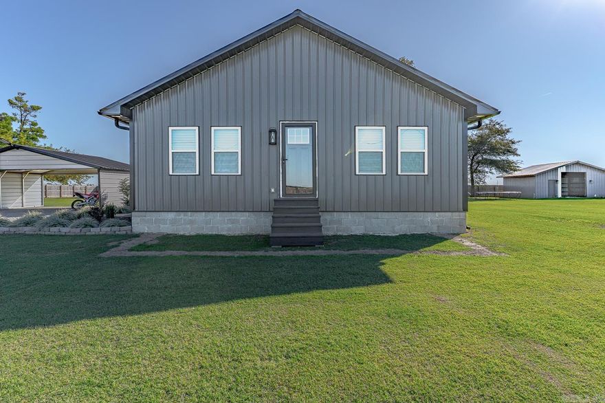 Welcome to 3948 N County Road 17 in Leachville, AR! Built in 2023, this barndominium features 3 bedrooms, 2 bathrooms, and 1,200 sq. ft. of living space on a fully fenced and gated 1-acre lot. Enjoy peaceful rural living while remaining close to town.  The home offers spray-foam insulation throughout, insulated windows, granite countertops, and a gas oven. Also a full guttering system, electric water heater, and electric HVAC provide energy efficiency, cheap utilities and year-round comfort.  A 1,200-gallon concrete septic serves the main home, with a second septic system for the detached mother-in-law suite. The property also includes a covered two-car carport and a barn that can be finished into a shop or workspace. This property qualifies for the Work Here Live Here Program, offering additional incentives for eligible buyers — a great opportunity to own a modern, efficient home in a peaceful rural setting. Call today to schedule your showing.