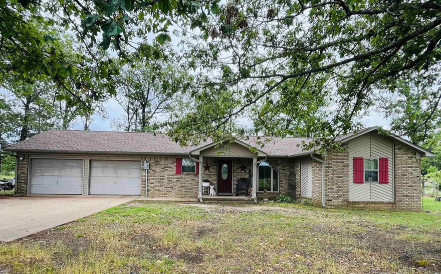 Enjoy peaceful country living with this beautiful property featuring approximately 20.73 fenced acres, 2 ponds, and plenty of space for animals, gardening, and outdoor living. The home offers a cozy woodburning fireplace with thermostat and insert, granite countertops, mosaic tile backsplash, and a new stainless steel dishwasher in the kitchen. Bathrooms feature granite top vanities, ceramic mosaic tile, a walk-in tiled shower in one bath, and a tub/shower combo in the other. Additional features include Brazilian hardwood flooring in the kitchen, dining room, living room, and one bedroom, tile flooring in the bathrooms and laundry room, double hung insulated windows, PEX plumbing, and an approximate 5-year-old architectural shingle roof with ridge cap. Outside you’ll find a concrete patio, basketball goal, treehouse, and plenty of room to enjoy the outdoors. Property improvements include a 30x40 barn with 4 stalls and tack room, 16x12 shed with two lofts, 20x20 storage building with lean-to tractor shed, and an 18x18 dog pen with concrete floor. A great opportunity to enjoy quiet country living with room to spread out! This one is a must see! Message me for the video!