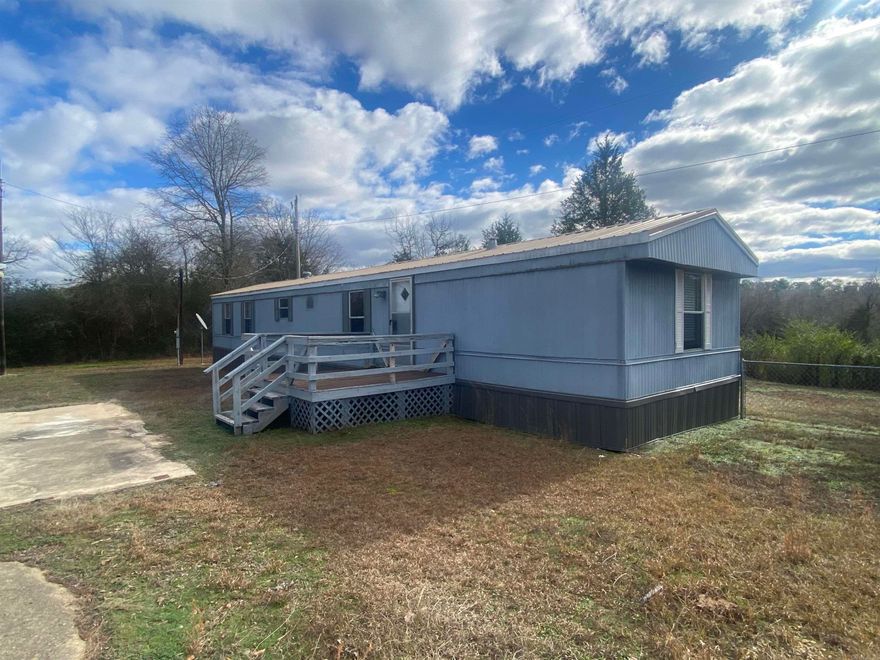 Wanna be close to Lake Ouachita??  Here is your place right here! 37 Mockingbird Lane, Story, AR. $118,000.00 An open feel 2 bed, 2 bath mobile home located right near Lake Ouachita sitting above Deer Creek in the Washita Community. This property is the perfect size for someone escaping their daily grind and want to get away!  Store your boat and other lake items in the 30x30 metal shop building with 2 overhead roll-up doors.  Property is selling with some furnishings, so you can just bring your clothes and yourself!  You can launch your boat in like 5 minutes!  Call today