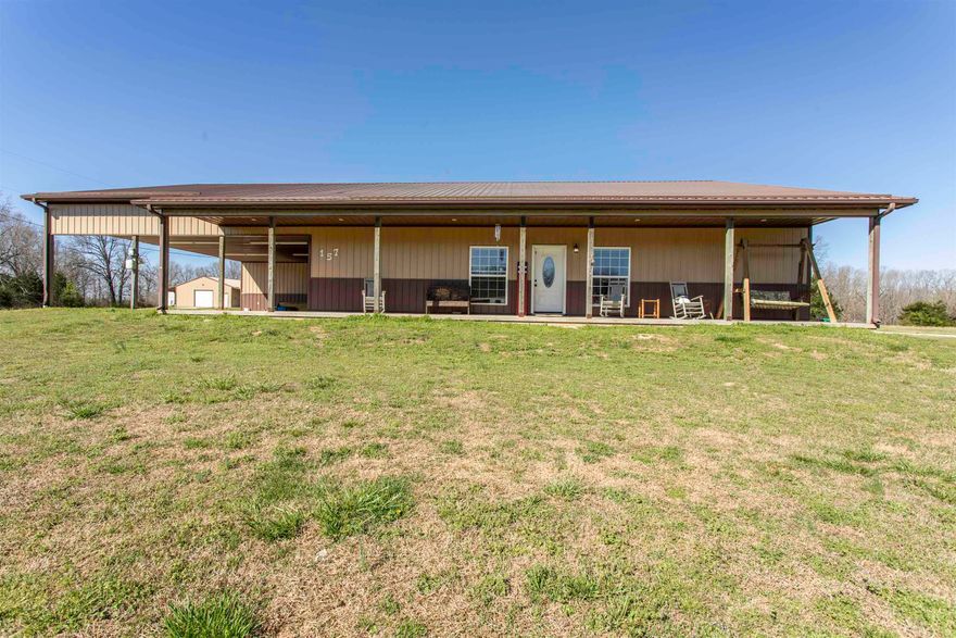 Country home  One-of-a-kind custom home on 12 acres m/l in Sharp County just outside city limits! This energy-efficient, all-electric metal home built in 2016 offers approx. 2,500 sq ft with 4 bedrooms, 2.5 baths, spacious living, large laundry, abundant storage, and an oversized pantry with space for a second fridge. New HVAC in main house. Property to be sold with a 1 year home warranty paid for by seller.   Property features a 30x50 shop with apartment potential, a 1,500 sq ft guest house (3 bed, 2 bath), plus 2 additional storage buildings—ideal for multi-generational living, rental income, or home-based business.  Enjoy +/- 12 acres of usable land perfect for ATVs, hunting, and outdoor living, complete with playground and beautiful oak tree. Relax on front & back porches or entertain under the 3-car carport.  Private setting just off pavement, yet convenient to Walmart (3 mi), hospital (2 mi), and schools (1 mi). Rare find with space, versatility, and income potential!