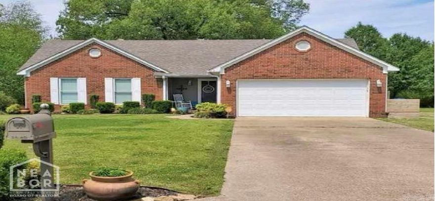 Welcome to the market another Compass Rose Realty Exclusive located at 1910 Sandbrook in Jonesboro, Arkansas! This lovely 3 bedroom/2 bath home is just minutes from all the amenities of town in a lovely neighborhood. The living space has a vaulted ceiling along with a cozy gas log fireplace. The kitchen has had backsplash put on and has a ton of cabinet space. There is a utility room just off of the kitchen which leads out to a 2 car garage. There are also tons of shelving along both sides of the garage to help with storage. All three bedrooms have walk in  closets to provide efficiency in space! There is a patio area out back with a deck to enjoy the outdoors. This is a well kept home in a great area! Don't miss out on this opportunity to make an investment for tomorrow!