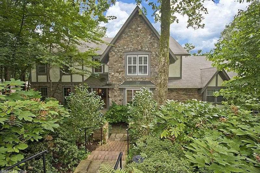 PRIVACY!! This beautiful home has many facets that entice.  Large master suite, oversized den/sunroom, 3 fireplaces, true keeping room, 2 bedrooms upstairs open to a TV/study area for a suite that is ideal for kids and/or nursery +.  Large kitchen opens to keeping room.  Playroom is also on main level.  Lower level has workout room with treadmill and universal gym.  Garges for 4 cars + 275 sq ft  shop behind detached garage accessed thru overhead door for auto/boat use. 2nd shop below is approx 275 sq ft