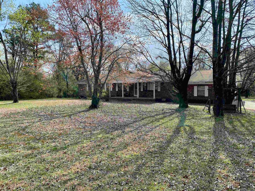 Spacious custom built home on Hwy 64 in Clarksville just outside of the city limits on over 3 acres.  Fenced lawn w/ large shade trees a livestock shed & equipment/storage shed.  Double garage w/ direct access to an above ground safe room.  Formal living plus den, semi-formal dining space, & a galley kitchen (all appliances included).  Large master w/ ensuite and double closets.  To be sold as-is as the owner has priced accordingly allowing the buyer the opportunity to remodel to their specs.