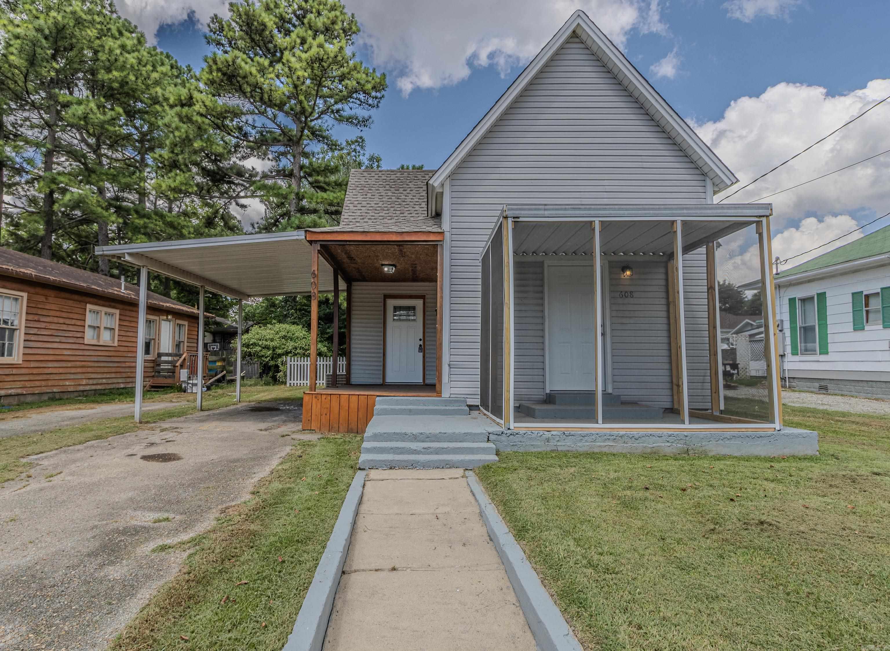 Allow me to introduce you to this bungalow-style home offering timeless curb appeal and a welcoming covered front porch. The property features a spacious carport and a generous lawn, ideal for outdoor living or future landscaping visions. With its inviting accented entry and screened-in porch, this cozy retreat is perfect for anyone seeking comfort with character. Located just minutes from nearby amenities and positioned for convenience ā itās a gem waiting to be discovered. Inside this bungalow-style retreat you will discover an interior with timeless touches. The kitchen features warm wooden cabinetry, sleek stainless steel appliances, and a window-lit layout perfect for casual cooking or cozy entertaining. The modern bathrooms features a contemporary shower and large bathroom vanity with cabinets. The seller is offering incentives toward interest rate buy down or possible seller closing costs paid of up to $5000.00
