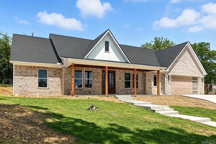 Located just minutes from Lakeside Schools, this beautiful 3-bedroom, 2.5-bathroom home with an office blends quality craftsmanship with timeless style. From the moment you arrive, the classic brick exterior and charming covered front porch create an inviting first impression. Step inside to discover a show-stopping interior featuring an open, split floor plan with elegant tray ceilings, abundant natural light, and stylish finishes throughout. The kitchen is a chef’s dream, highlighted by sleek quartz countertops, a spacious walk-in pantry, and custom cabinetry – perfect for hosting and everyday living. The primary suite is your own private retreat with a spa-like ensuite bath, oversized walk-in shower, and a generous walk-in closet. Thoughtful extras include a large laundry room with bonus storage, a covered back patio for relaxing evenings, and modern touches that make this home stand out. Don’t miss this opportunity to own new construction in one of Hot Springs’ most sought-after neighborhoods. Schedule your private showing today and make 248 Cromwell your forever home!