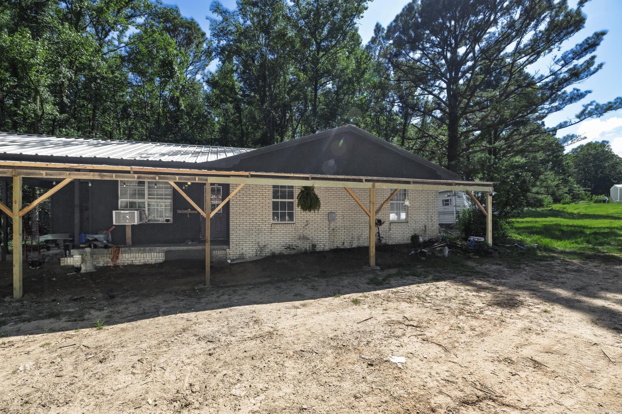 Welcome to this charming three-bedroom, two-bath home in Bismarck, Arkansas, nestled on half an acre in a peaceful, rural setting. Surrounded by Ross Foundation land, this property offers a rare sense of seclusion and natural beauty. The home has been thoughtfully updated throughout, including a brand-new mini-split system for efficient comfort year-round. Whether you're looking for a perfect starter home or simply craving quiet country living, this inviting space offers a great opportunity to enjoy the outdoors and escape the hustle and bustle. Don't miss your chance to own a slice of tranquility in the heart of the countryside.