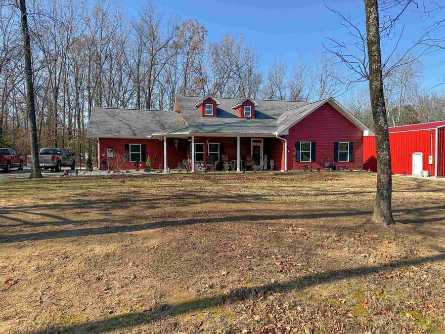 Listing 25015: Take a look at this nice 3 bedroom, 2 bath home on 1 acre in Mountain View, AR, sitting near the end of a quiet street inside city limits. This 1,444 sq ft home has a comfortable floor plan with great natural light, a gas log fireplace in the living area, and a sunroom with an attached storage room. The master suite offers a double sink vanity, and the guest bath has a tub/shower combo. The home is built on a concrete slab and includes a floored attic for extra storage as well as a finished garage. Outdoors you’ll find a welcoming front porch with shade trees, paved road access, and plenty of space to enjoy. A major bonus is the 30x40 shop with blown insulation, peg board, and a mini split—perfect for projects or equipment. There is also a fenced-in slab area ideal for pets, gatherings, or outdoor entertaining. Convenient location close to town, but with a peaceful feel. A great property with room to work, relax, and make your own. Priced at $415,000