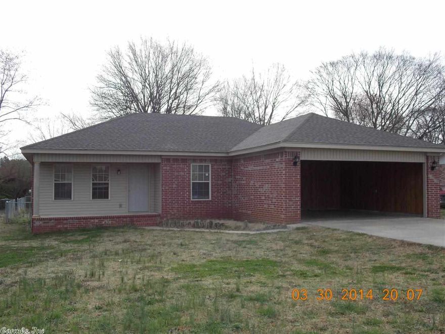 Nice brick home on 1.5 lots for large yard, double car garage, stained cabinets, crown moulding, separate laundry, laminate flooring, fenced yard, new garage door will be installed, new paint, all on almost 1/2 acre in Westside school area.