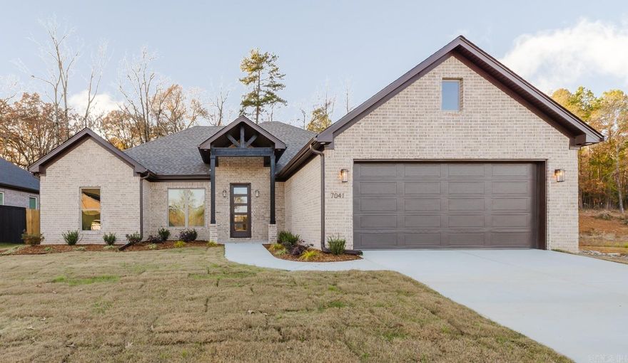 Best location in Bryant-Another stunning build by J&P Homebuilders and this one is a showstopper. Creekside Subdivision-  3 Bedrooms | 2 Baths | Office | Open Floor Plan | Patio Fireplace | Backs to the Woods | Tankless Water Heater |  Gutters | Lots of Storage.  This gorgeous single-story home blends modern elegance with cozy charm and high end finishes. (New Street: use 7024 Cold Creek)