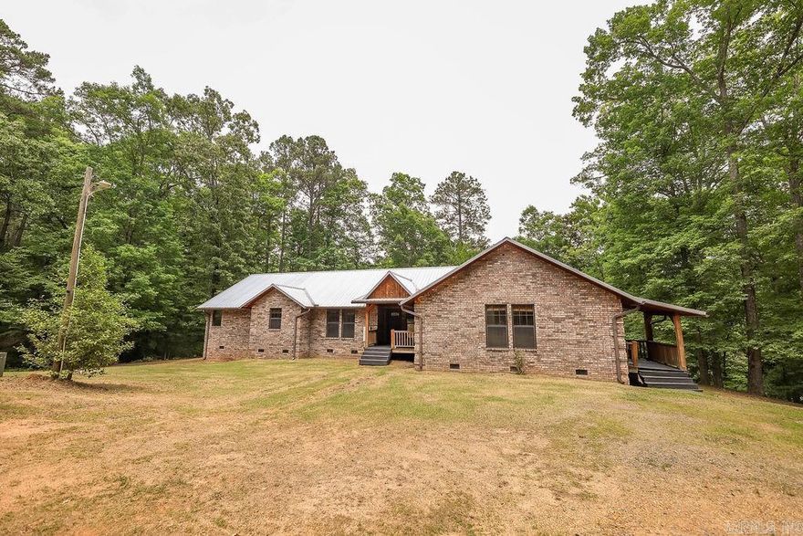 Embark on a sensory journey as you soak in the sights and sounds of your personal haven.  This sprawling 2800 square foot custom built home radiates warmth and rustic elegance.  The living room features a magnificent wood burning stove, the perfect centerpiece for cozy evenings.  Floor to ceiling windows flood the space with natural light and offer breathtaking views of the surrounding landscape. The spacious island and custom pantry are designed for both everyday meals and entertaining guests.  The luxurious master bath offers a spa-like experience with a garden tub and expansive walk-in shower.  Enjoy the luxury of instant hot water thanks to the dual tankless water heaters.  With safety in mind, this home features a steel-reinforced concrete safe room.  This multifunctional space can seamlessly double as a fourth bedroom or office/study.  Designed to provide peace of mind, it offers both security and versatility without compromising style.  An integrated cell phone booster ensures strong and reliable connectivity throughout the entire home.  Square footage independently measured by seller.  Contact us today for more details!