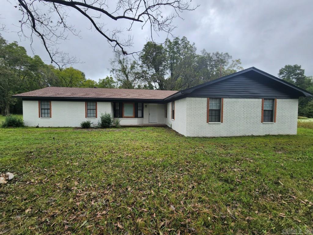 Welcome home to 5101 Judy Rd in North Little Rock. Come see this oasis sitting on almost 3 acres, with a pond on the east side of property and undeveloped land on the north boundary. Privacy, peace and quiet, yet only minutes from all North Little Rock and Little Rock amenities. Updated home with new roof 2024, new kitchen, flooring, paint, lighting and plumbing fixtures, granite countertops, appliances and walk in showers. Large laundry room with sink, plus large bonus room perfect for additional laundry area, pantry or storage. Includes 2 car garage and large carport that would be great for additional entertaining space. Separate dining room would also make good office space. Eligible for 100% RD financing. See Showing Remarks.