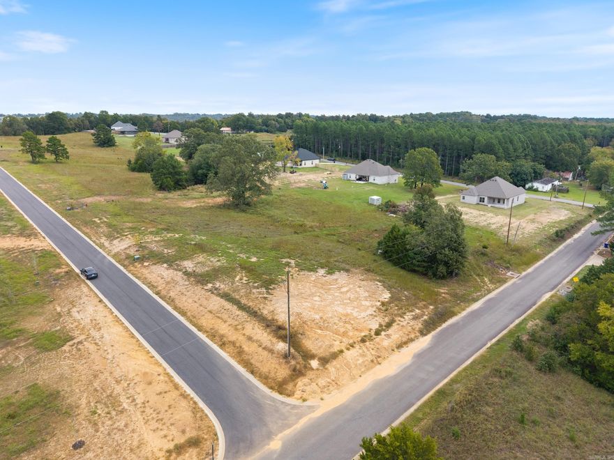 Here’s your chance to build your dream home on one—or both—of these beautiful side-by-side lots. Each offers .88ish acres, complete with curb and gutters already installed, a completed perk test, and utilities nearby. Buy one and start building now, or purchase both for additional acreage and even more room to spread out. The location offers the perfect blend of space, convenience, and small-town charm. Bring your builder, your house plans, and your imagination—these lots are ready when you are. See MLS# 25040302 for other lot.