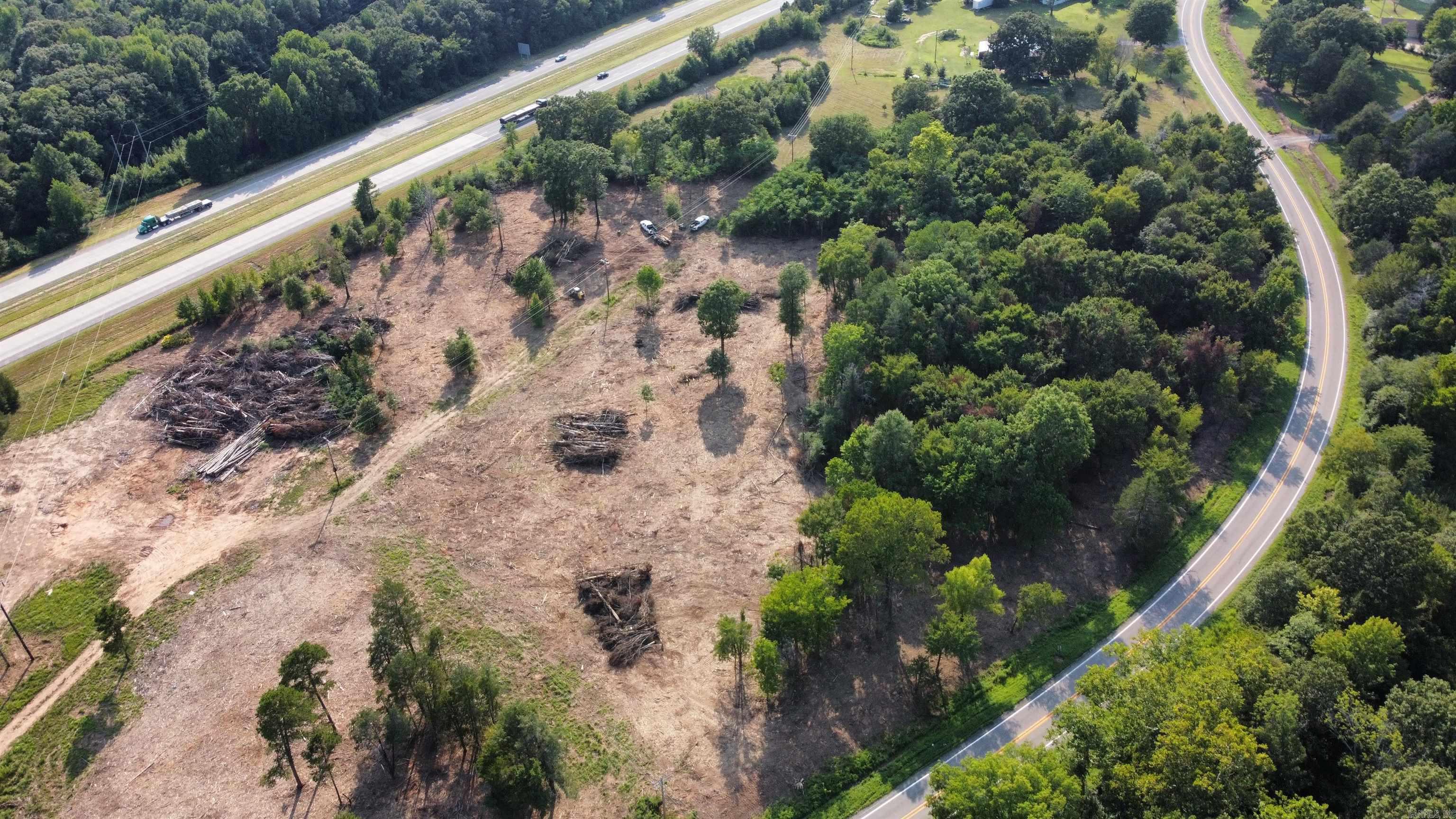 Introducing a rare opportunity! This expansive 20-acre parcel of prime land is a canvas awaiting your vision. Nestled alongside the bustling I-40 interstate and adjacent to Highway 352, it boasts unrivaled accessibility and visibility, making it an ideal location for a variety of ventures. Whether you envision a commercial development, residential community, or an industrial project, this land's potential is boundless. Schedule your showing today.