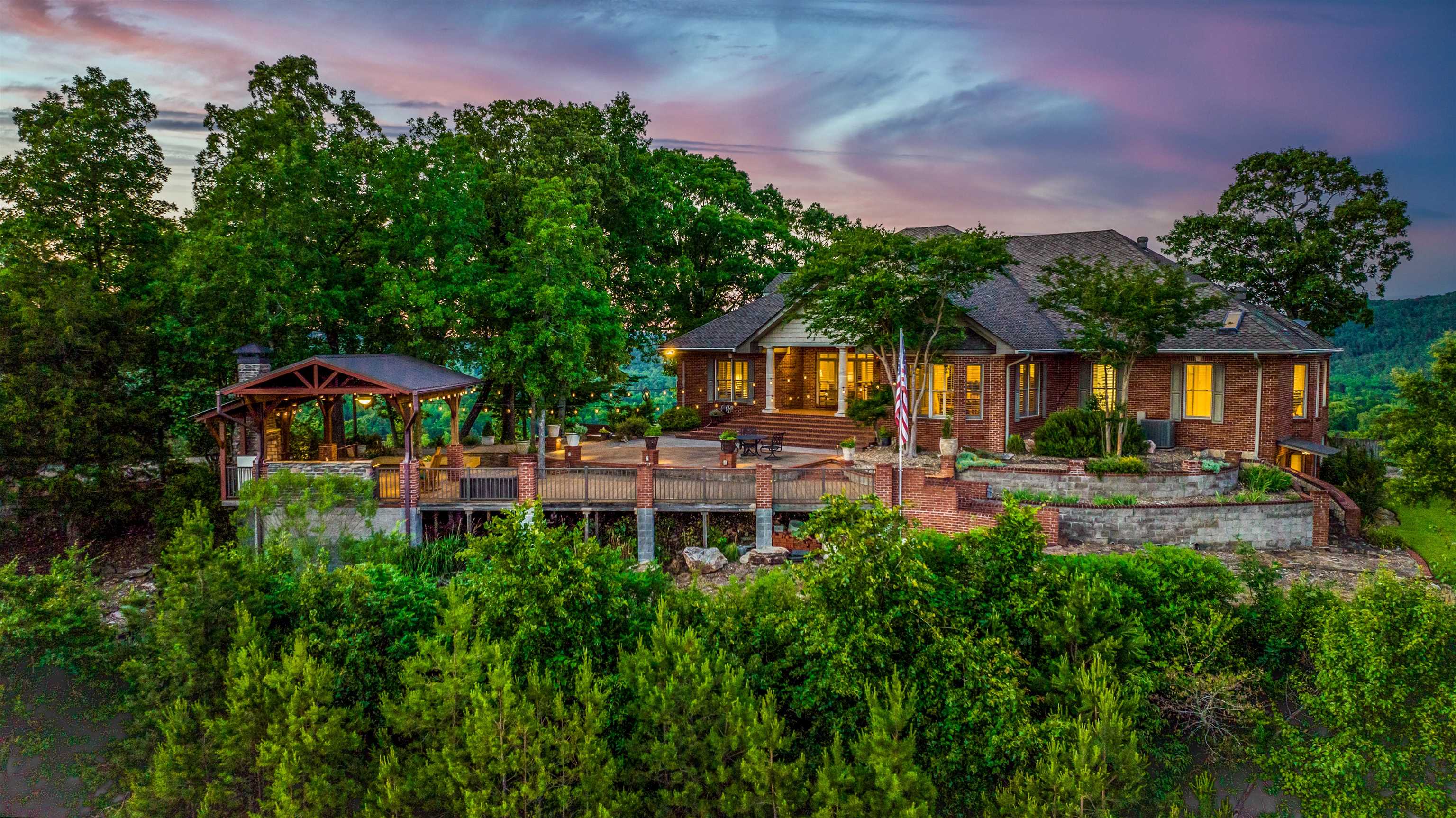 This is a glorious 6 Bed 5 Bath on 6.2+ Acres in the gated Ridgefield Estates with panoramic views over Pinnacle Mountain. Through the gate up the private drive is your immaculate patio with the gazebo’s wet bar & stacked stone fireplace. Inside, you’re welcomed with original hardwoods, 9’ ceilings, updated lighting, and freshly painted walls throughout. Enter at the open foyer that leads to your gorgeous great room with the heat system integrated wood burning fire and double French doors...