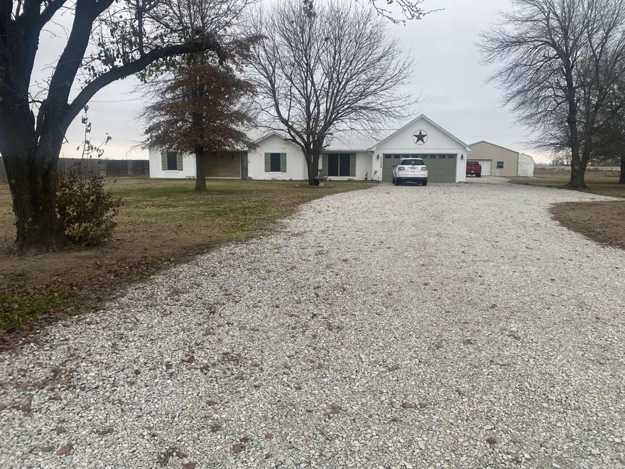 New Listing on Maple Grove Lane! This property has a lovely 2 bedroom/ 2 bath home with front porch, and sits on 1.2 acre lot. A nice chat drive leads to a 30' x 30' heated/cooled workshop. About 15 years ago the home was extensively remodeled including new kitchen, new hardwood flooring, bathroom fixtures and more. The back porch offers so much fun as a living space with its double swings and puppy-friendly fenced area. A new septic tank was installed 8 years ago, new metal roof 7 years ago. There's so much here to see, just give us a call.