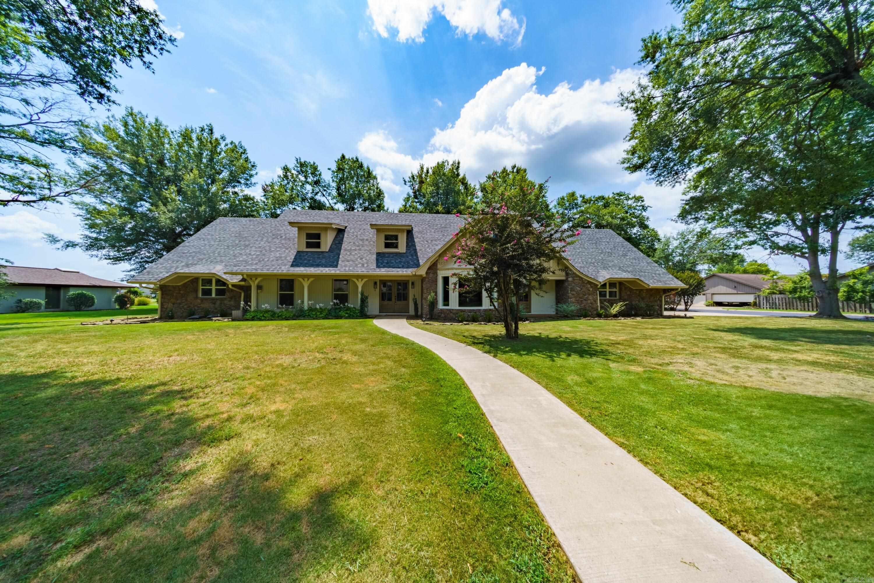 Luxury 4-Bedroom Home with Over 7,000± Sq Ft Under Roof ā Premier Arkansas Neighborhood 4 Bed | 4 Bath | 5,800± Sq Ft Heated/Cooled | Chefās Kitchen | Bonus Room | 3-Car Garage This spacious, fully updated home offers over 7,000± sq ft under roof and 5,800± sq ft heated/cooled, designed for elegant everyday living and entertaining. Features include a chefās kitchen with gas cooktop, brick surround, two sitting areas, and a breakfast nook, plus a formal dining room that seats 18+. The main level boasts a grand foyer with sweeping staircase, a large living room with vaulted ceilings and a floor-to-ceiling fireplace, a luxurious primary suite with soaking tub and tiled shower, a guest bedroom with exterior access, laundry/mudroom, and 3-car garage. Upstairs includes two additional bedrooms with walk-in closets and sitting areas, a library loft, second laundry, a vaulted full bath, and a huge bonus room with kitchenette. The sunroom, heated/cooled by a mini-split, is perfect for hobbies or a home gym. Outside, enjoy a beautifully landscaped yard, private backyard, and room for a pool or garden. Located in a quiet, upscale neighborhood, this home is move-in ready!