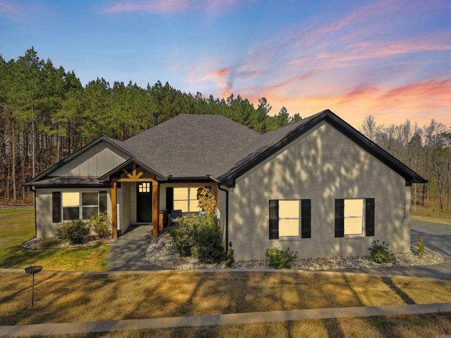 Beautiful one-level home on 2 private acres offering 4 bedrooms, 3 full bathrooms, and a dedicated office—conveniently located for commuting to Hot Springs, Little Rock, or Benton. Open-concept layout with tall ceilings, abundant natural light, beautiful flooring, and a brick fireplace with custom built-ins. Kitchen features a large island, granite countertops, stainless steel appliances, and custom cabinetry. Spacious primary suite includes dual vanities, soaking tub, and tiled walk-in shower. Covered back deck overlooks wooded acreage with custom stone fire pit and professionally terraced landscaping. Additional features include oversized heated and insulated garage with workspace and special coating on driveway and sidewalk. Agents see remarks and documents for more details on updates.