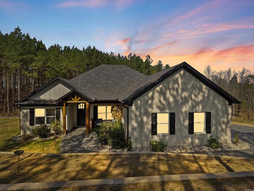 Beautiful one-level home on 2 private acres offering 4 bedrooms, 3 full bathrooms, and a dedicated office—conveniently located for commuting to Hot Springs, Little Rock, or Benton. Open-concept layout with tall ceilings, abundant natural light, beautiful flooring, and a brick fireplace with custom built-ins. Kitchen features a large island, granite countertops, stainless steel appliances, and custom cabinetry. Spacious primary suite includes dual vanities, soaking tub, and tiled walk-in shower. Covered back deck overlooks wooded acreage with custom stone fire pit and professionally terraced landscaping. Additional features include oversized heated and insulated garage with workspace and special coating on driveway and sidewalk. Agents see remarks and documents for more details on updates.