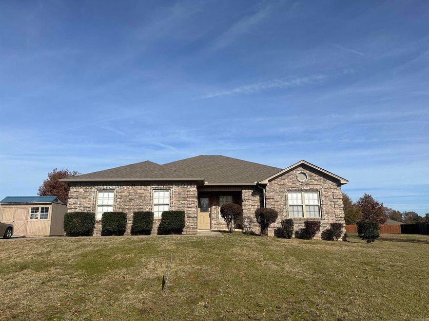 Home is vacant now. Custom home built on a nice piece of the countryside with neighbors scattered around the area.  Level, large lot for outside enjoyment!  Home features a HUGE living area with double tray ceiling treatment and gorgeous white brick fireplace!  Kitchen has an overwhelming amount of richly stained cabinetry space and granite countertops. Primary bedroom is also very large with walk in closet.  Bathroom has beautifully tiled walk in shower and jetted tub and granite counters.  Three bedrooms on other side of home with full bathroom and a tiled shower and granite counter as well. Updated wood laminate flooring accents the living room and halls as well. Roof has been updated and the septic system has been serviced recently. Survey on docsonline.  Note: Solar panels are NOT on this property-they are the neighbor's panels.  See agent notes.