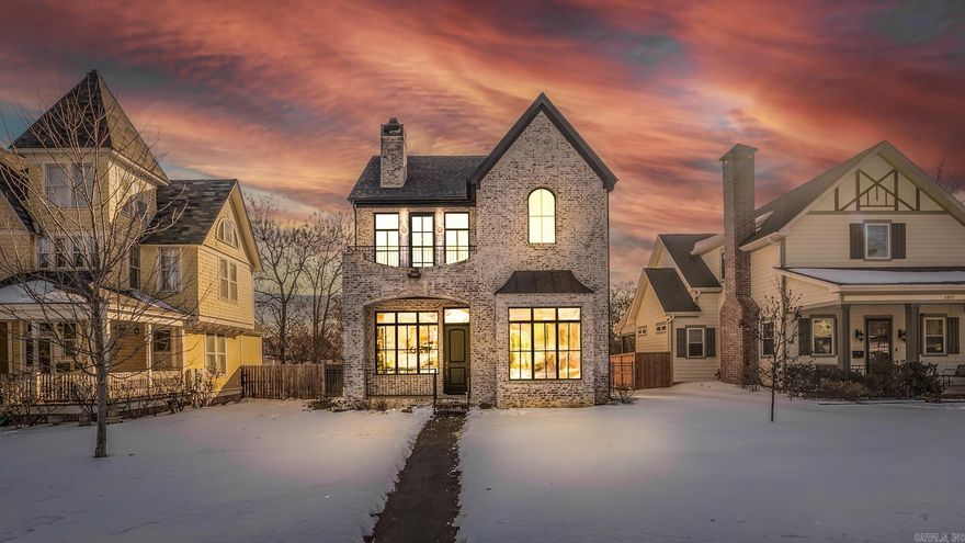 Beautiful new construction in the heart of Downtown Little Rock. This two-story brick home features 3 bedrooms and 2.5 baths with a thoughtful layout designed for everyday comfort and entertaining. The main level offers an open living area with modern finishes, a stunning kitchen with gas range, walk-in pantry, separate laundry room, and excellent storage throughout. Also on the main floor is a private half bath and the spacious primary suite. Upstairs includes two additional bedrooms, a full bath, and a second living area complete with a gas fireplace, abundant natural light, and a walk-out balcony; perfect for a media room, office, or flexible living space. A large walk-in attic provides ideal seasonal storage or potential to expand. Front and back porches extend the living space outdoors plus a fully fenced backyard offering privacy and functionality with a poured concrete pad with power ready for a hot tub. Additional conveniences include an enclosed carport and a separate storage building. Built with efficiency in mind, this home is equipped with solar panels installed in 2025, resulting in exceptionally low electric costs. Don't miss this downtown dream. Agents see remarks.